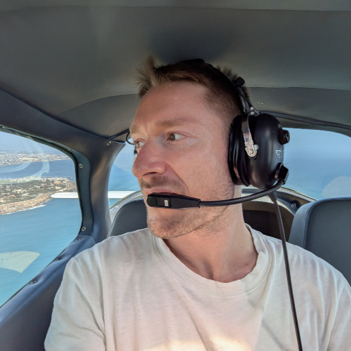 Franz Geffke at the controls of a light aircraft
